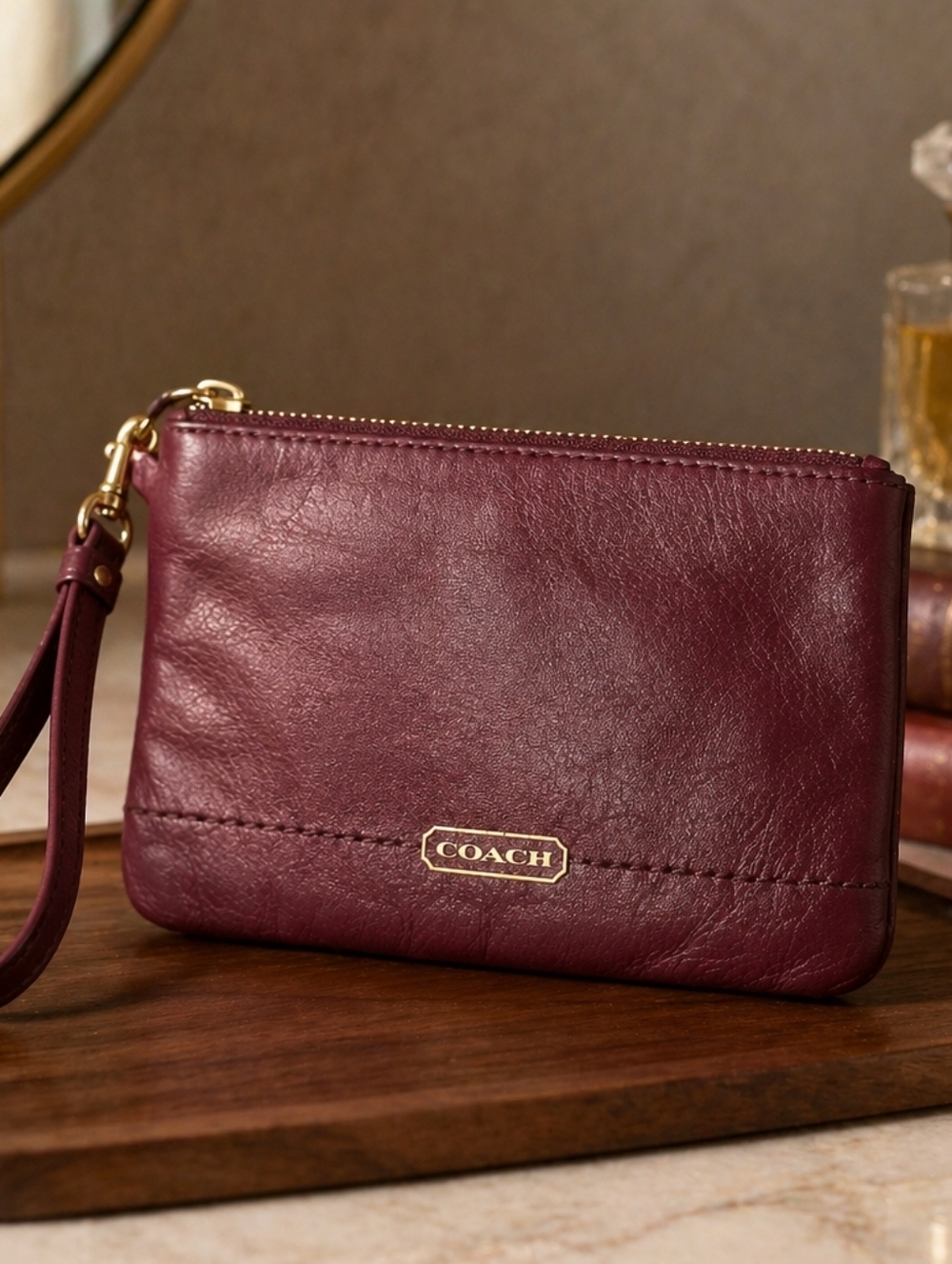 COACH Pebbled Leather Wristlet Clutch in Burgundy